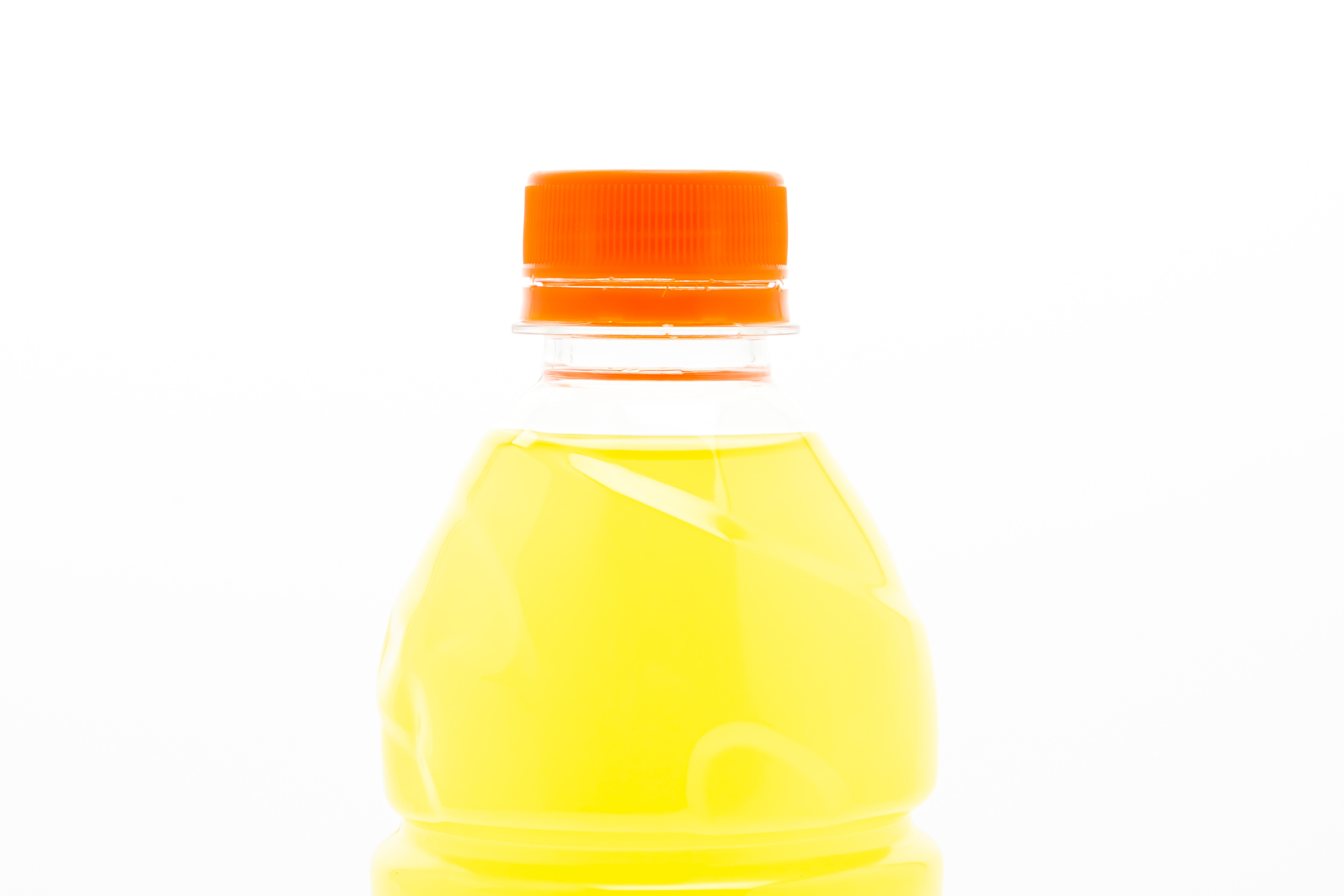 A bottle of yellow sports drink